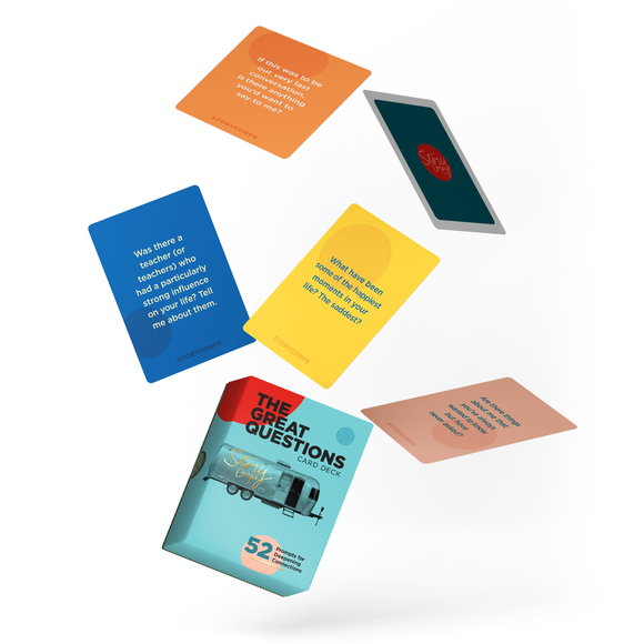 Colorful card deck with 'The Great Questions' on a white background